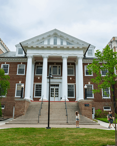 Students standing in front of the college admissions office.